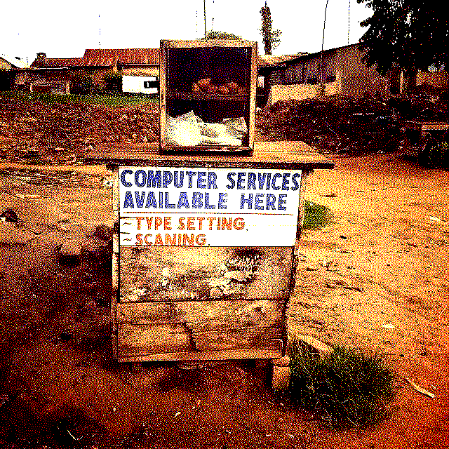 Farm stand with sign advertising "COMPUTER SERVICES"