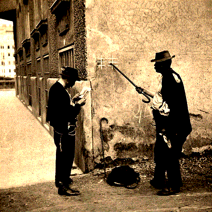 Two individuals inspecting some symbols on the wall of a building